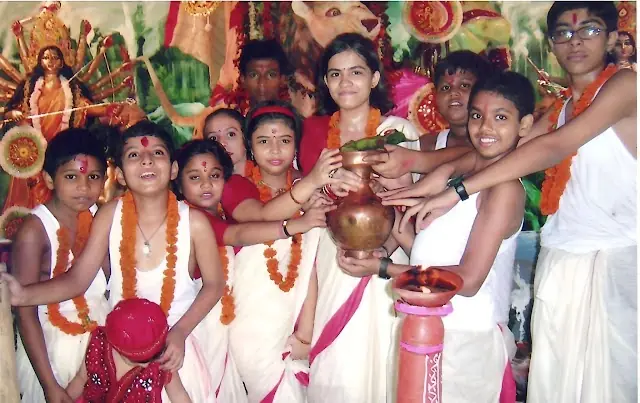 Young devotees with offerings