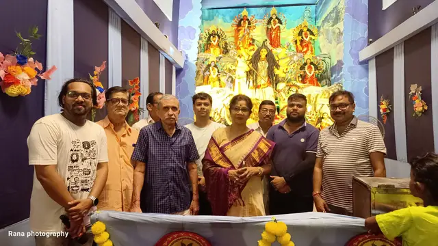 Members and guests before the goddess on Maha Shashthi (photo: Rana Photography)
