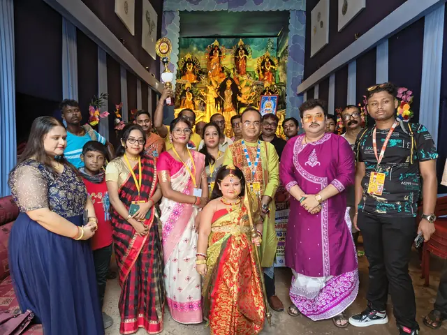 Visitors in their puja best at the pandal on Shashthi afternoon