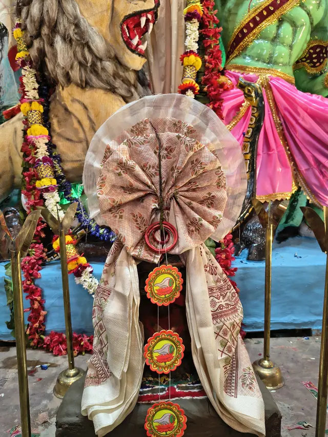 The kola bou (nabapatrika), dressed in a new sari on Saptami morning