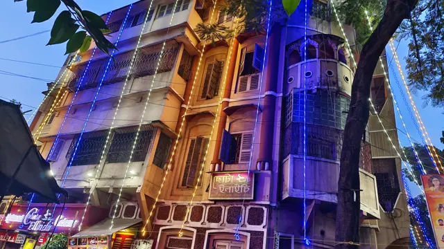 Strings of lights go up on the old houses of the para