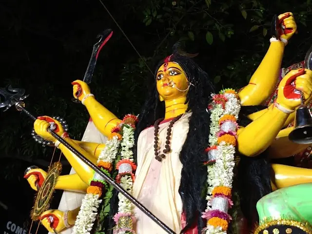 Devi Dashabhuja Durga — fair-complexioned, 10-armed, slaying Mahishasura