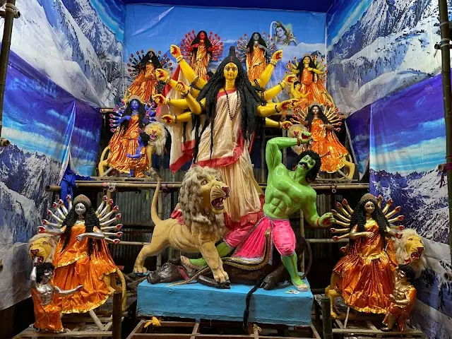 The Naba Durga idols — Dashabhuja Durga at the centre with the eight forms around her