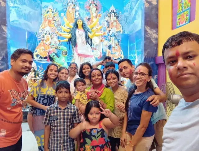 Devotees and families before the idols